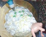 A picture of step 9 of Eggless Doll cake pineappple flavour.
