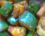 A picture of step 7 of Baigun bodi(brinjal in dried lentil dumplings).