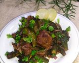 A picture of step 11 of Bhindi Gosht (okra).
