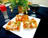 A picture of step 7 of Chicken tikka pizza.