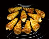Foto del paso 5 de la receta: Cañoncitos de masa de hojaldre, rellenos con dulce de leche