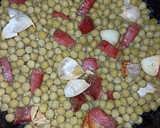 Foto del paso 3 de la receta: Guisantes al ajillo con jamón