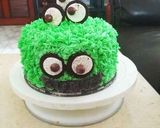A picture of step 18 of Monster Oreo Cake with Oreo Buttercream Frosting.