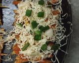 A picture of step 2 of French fries pizza.