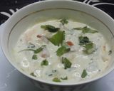 A picture of step 1 of Onion Tomato & Cucumber Raita.