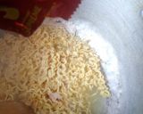 A picture of step 5 of Jollof Vegetable noodles with fried eggs.