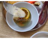 A picture of step 2 of Orange Kulfi in orange shell.