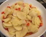 A picture of step 4 of Spanish Potato Omelette with Onion, Red Pepper, and Ham.