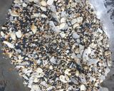 A picture of step 2 of Mixed seed and coconut chikki.