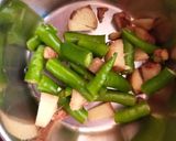 A picture of step 2 of Drumsticks Brinjal curry.