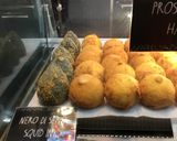 A picture of step 5 of Arancini ai formaggi - deep-fried, risotto balls with melting cheese middle.