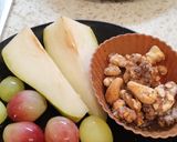 A picture of step 1 of Sliced 🍐 and grapes with walnuts. Healthy Juicy snack.