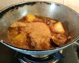 A picture of step 7 of Onion Tomato Chicken.