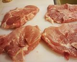 A picture of step 1 of Savoury Parmesan Herb Pork Chops.