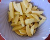 A picture of step 1 of Baked turmeric potato wedges.