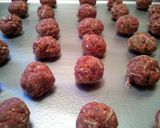 A picture of step 2 of Meatza pizza meatball subs.