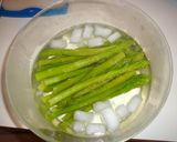 A picture of step 4 of Green Asparagus with Basil Pesto.