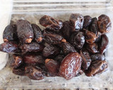 A picture of step 1 of Dates Wrapped in Bacon.