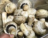 A picture of step 1 of Garlic Mushrooms Green Peas and Sweet-Corn Fried Rice.