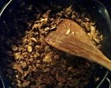 A picture of step 1 of Tinklee's Easy Sausage Sauce and Frozen Ravioli.