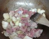 A picture of step 1 of Butter Sweet Curried Pork.
