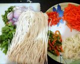 A picture of step 1 of Veggie noodles with mint leaves.