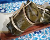 A picture of step 5 of Khao Tom Mud (Thai Sticky Rice Banana Parcels).