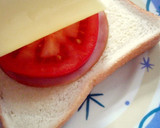 A picture of step 3 of Toast with Ham, Tomatoes, and Cheese.