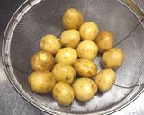 A picture of step 1 of Small New Potatoes Sautéed Teriyaki Style in Sweet and Sour Miso.