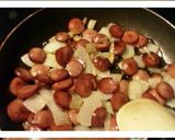 A picture of step 4 of Mac & Cheese with fried onions and smocked sausage.