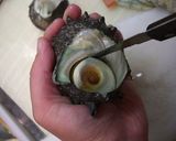 A picture of step 3 of Fresh Turban Shell Sashimi.