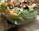 A picture of step 9 of Filling healthy dinner: salmon salad with horsradish dressing and garlic bread on the side.