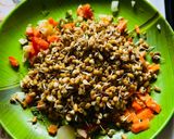 A picture of step 1 of Sprout Salad with carrots cucumber tomatoes.