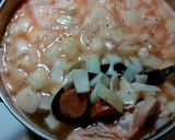 A picture of step 2 of Chicken rice soup Portuguese style.