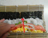 A picture of step 10 of Salad Roll (with rolling instructions).