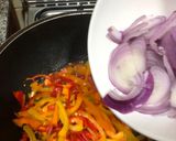 A picture of step 5 of Mac and bell peppers stir fry.