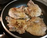 A picture of step 1 of Smothered Pork Chops.