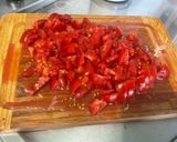 Une image de l'étape 18 de Poulet aux cacahuètes, carottes, tomates et épices.