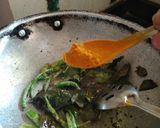 A picture of step 12 of Fafada-Kadhi with Grated Raw Papaya.