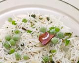 A picture of step 4 of Onion Green Peas Pulao with leftover Rice.