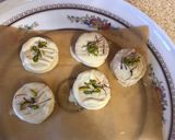 A picture of step 3 of Chocolate covered Ritz crackers filled with white chocolate or peanut butter.