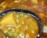 A picture of step 15 of Alu matar gravy.