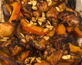 A picture of step 5 of Tray bake pumpkin & chicken thighs topped with roast pumpkin seeds.