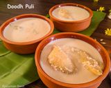 A picture of step 14 of Dudh Puli Rice dumplings cooked in milk.