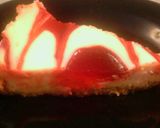 A picture of step 6 of Creamy strawberry swirl cheesecake.
