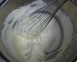 A picture of step 10 of Cocoa Crepe Roll Cake with Whole Strawberries.