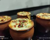 कुल्हड पिज़्ज़ा)kulhad pizza recipe in hindi) रेसिपी चरण 9 फोटो