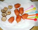 A picture of step 3 of Bento Acorns with shimeji mushrooms and wiener sausages.