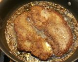 A picture of step 5 of Fried steak with rice and garlic bread.