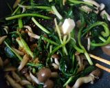 A picture of step 4 of Ramps and Mushroom Consommé Butter Stir-fry.